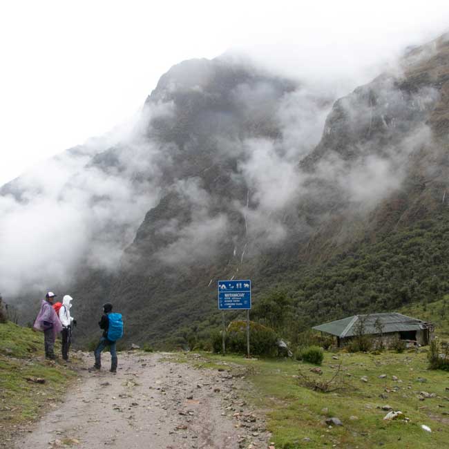three people hiking in Huayracmachay